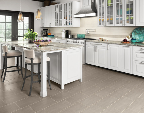 Kitchen scene featuring Koncrete Daltile; lighter shades with white cabinets and kitchen island