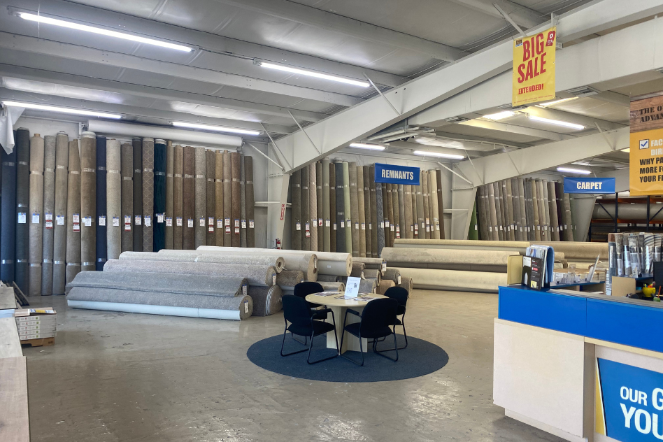 salesperson in flooring store with customer